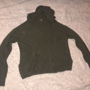 Green sweater with holes